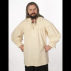 Man standing with hands on hips wearing natural colored Pro Series Blackbeard natural colored shirt with opening at top.