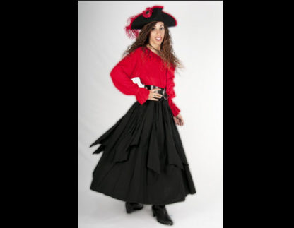 Woman wearing red shirt, black skirt and black hat.